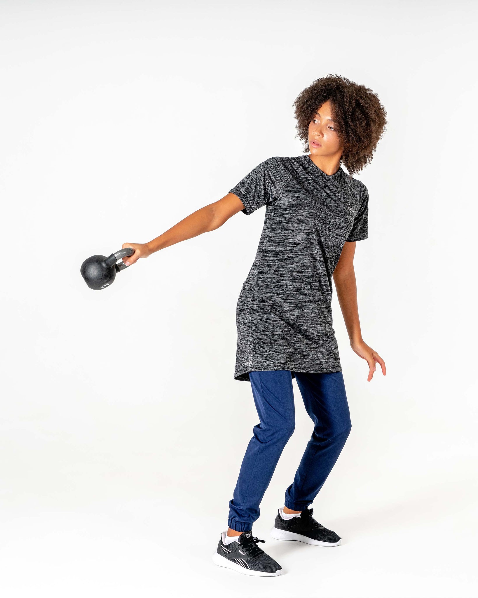 Connect T-Shirt Dress in Black by Veil Garments. Modest activewear collection.