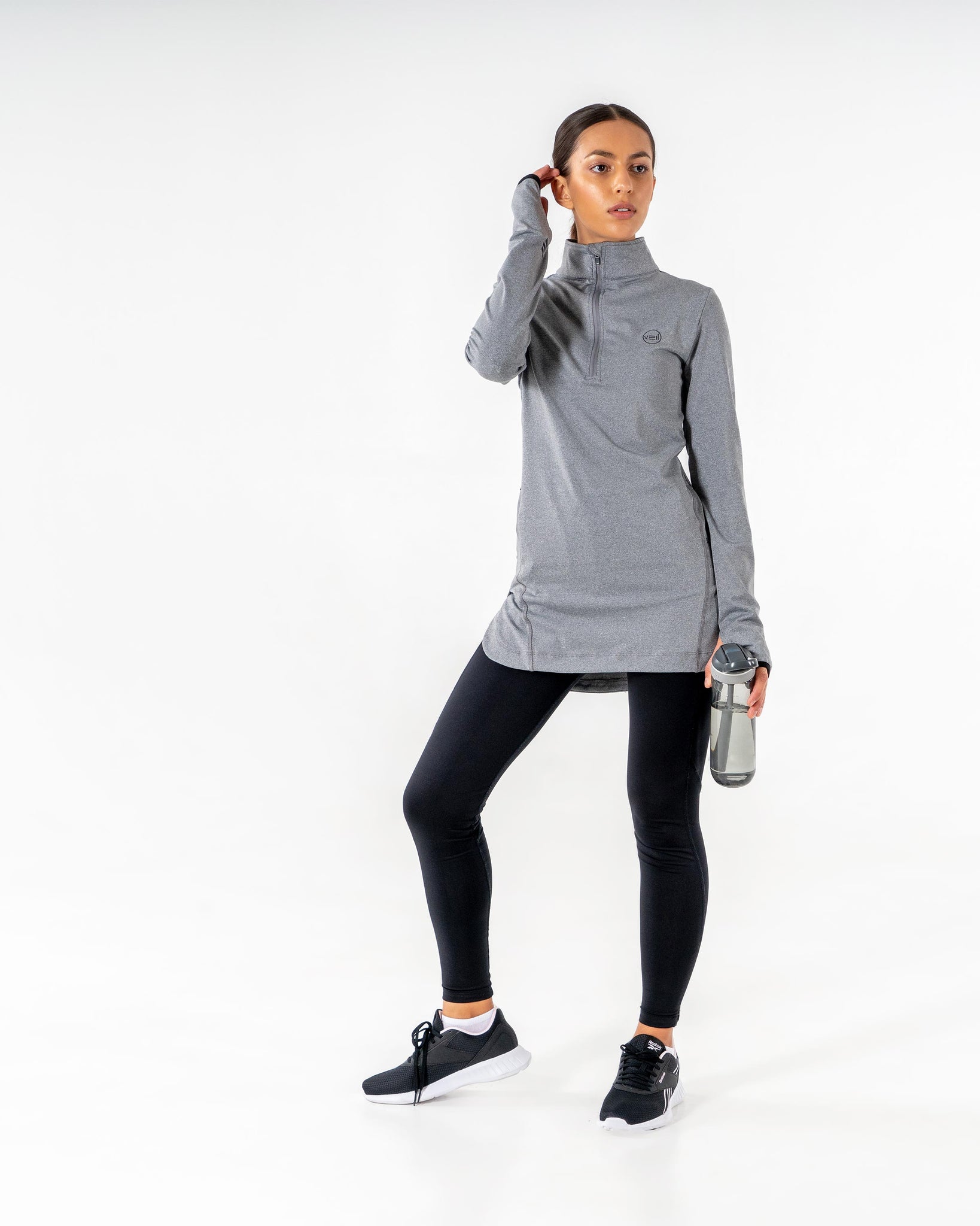 Spark Half-Zip in charcoal grey by Veil Garments. Modest activewear collection.