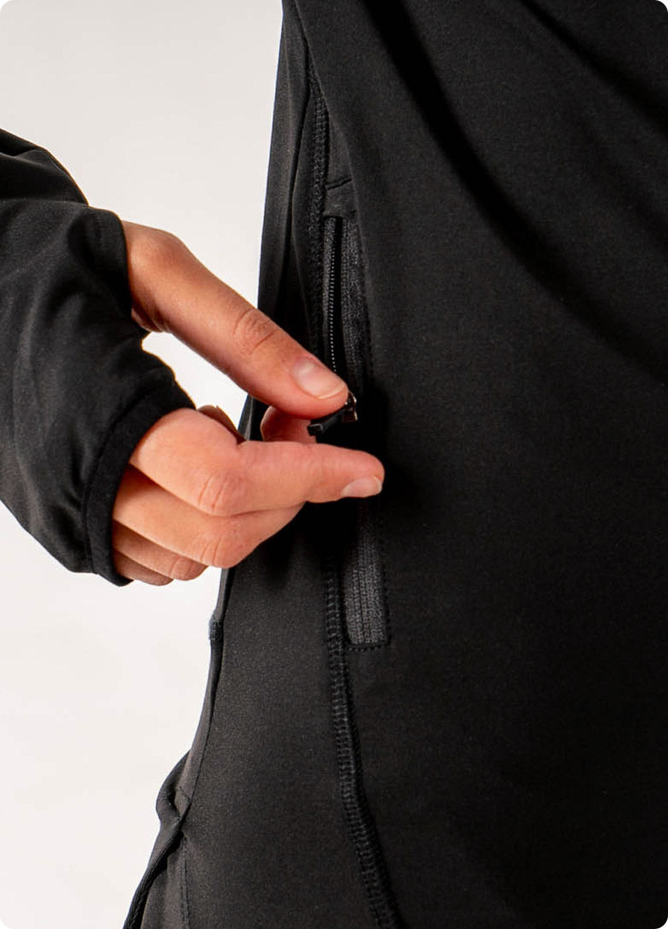 Veil Garments Spark Half-Zip features: Front pocket for phone and small item storage