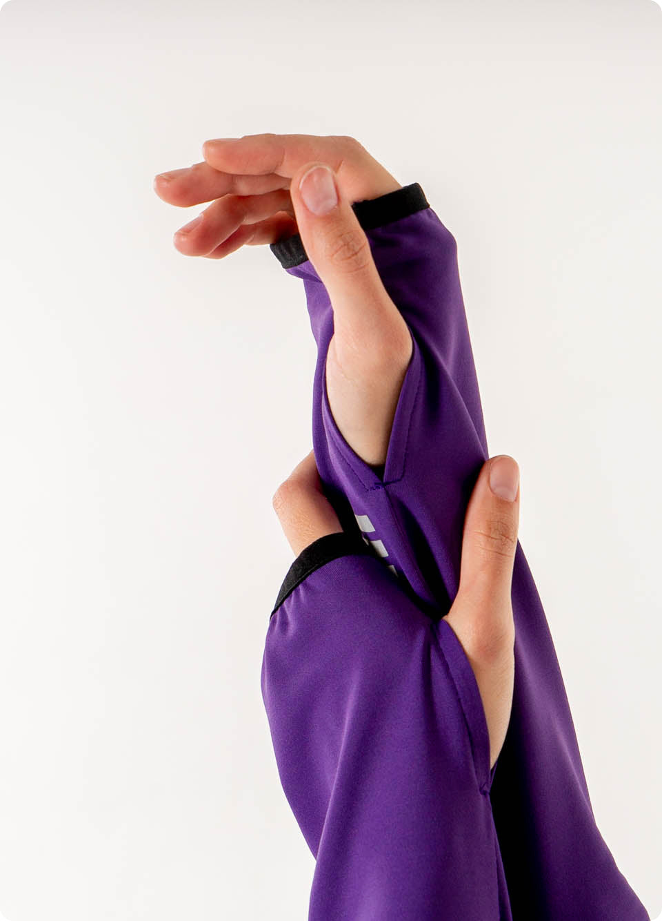 Veil Garments Spark Half-Zip features: Thumbholes for extra warmth