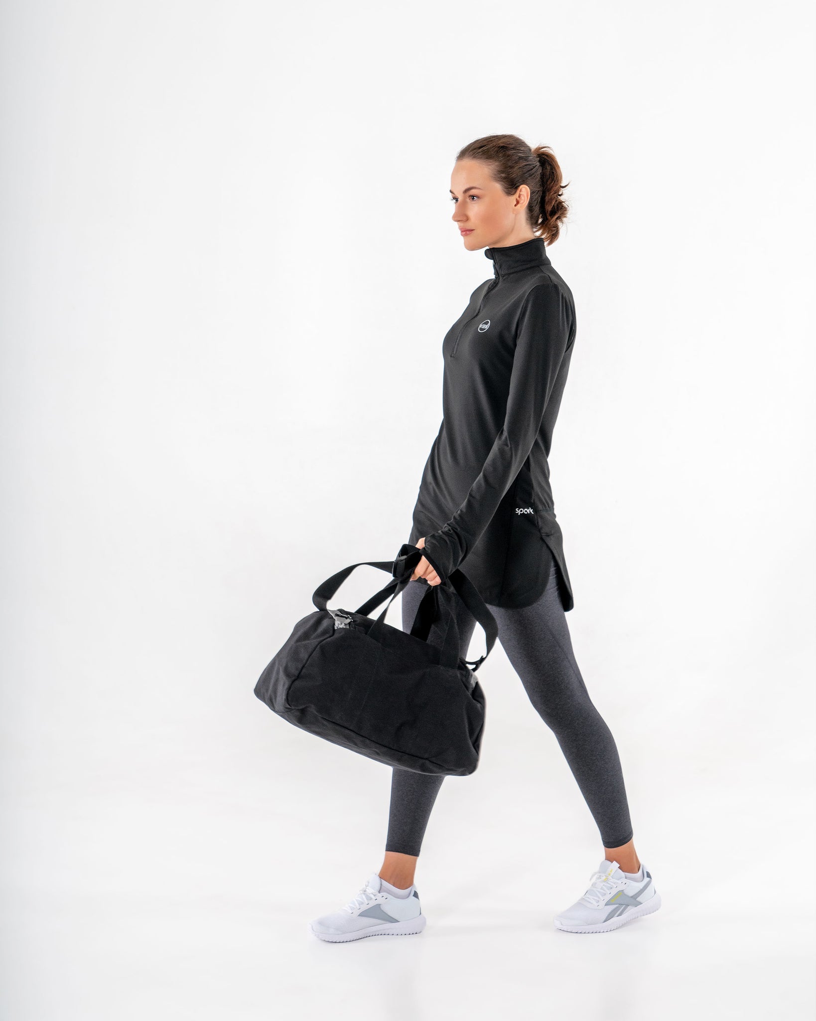 Spark Half-Zip in black by Veil Garments. Modest activewear collection.