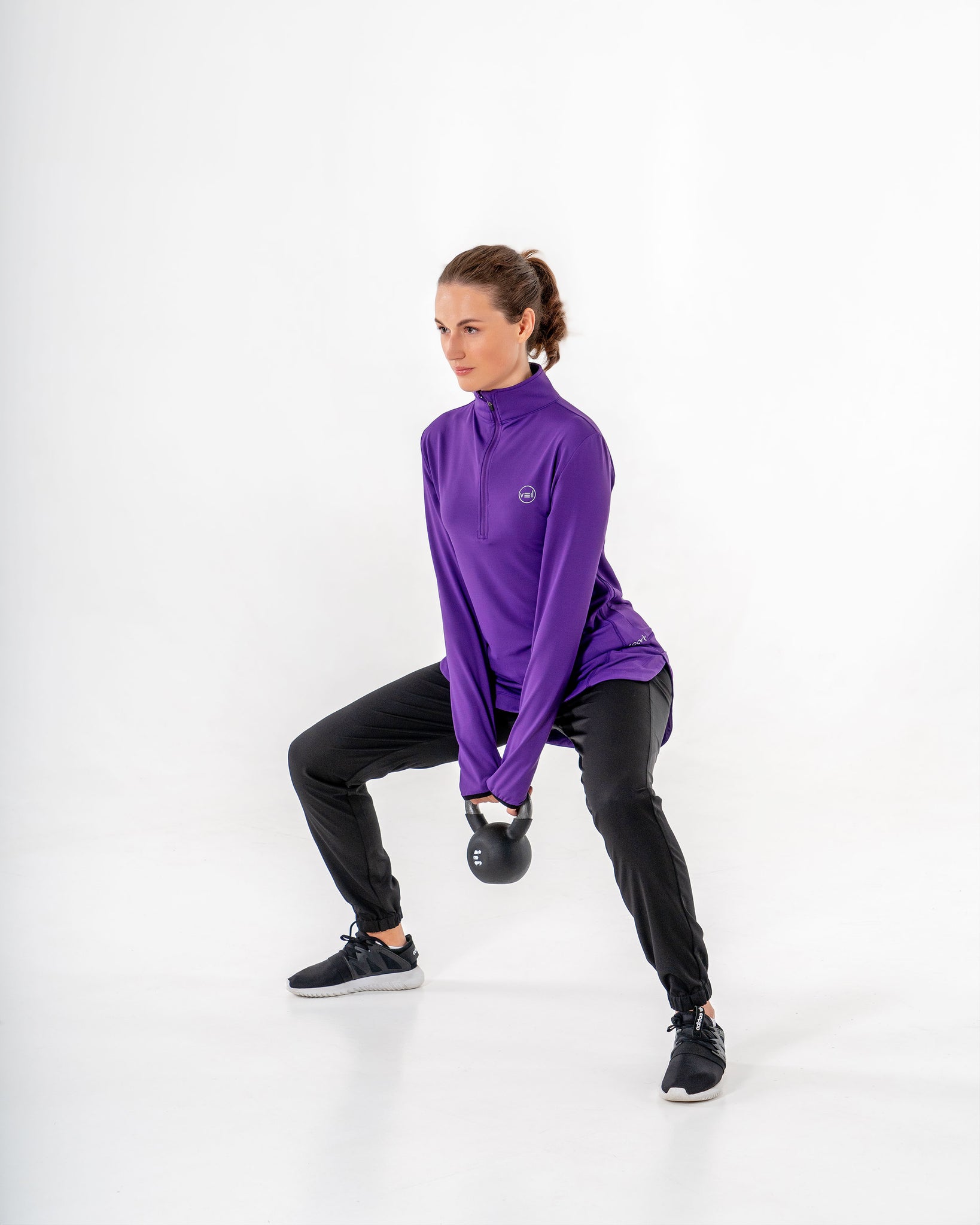 Spark Half-Zip in purple by Veil Garments. Modest activewear collection.