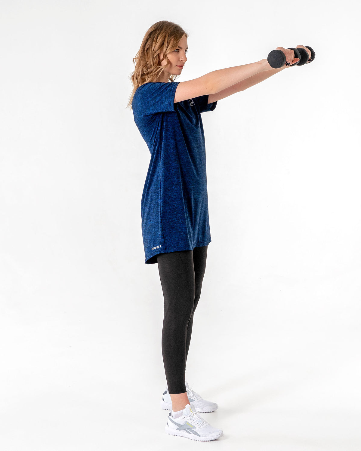 Connect T-Shirt Dress in Blue/Black worn while raising a dumbbell to shoulder height.

#color_blue-black
