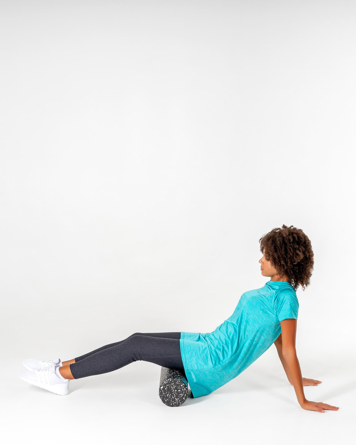 Connect T-Shirt Dress in Turquoise/Metallic Silver worn sitting on a foam roller.

#color_turquoise-metallic-silver