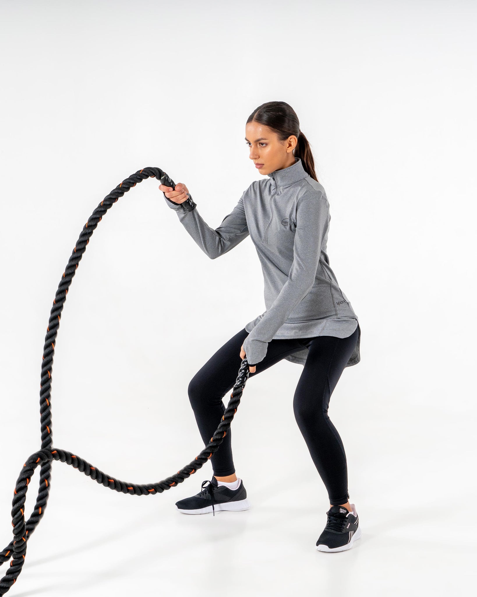 Spark Half-Zip in charcoal grey by Veil Garments. Modest activewear collection.